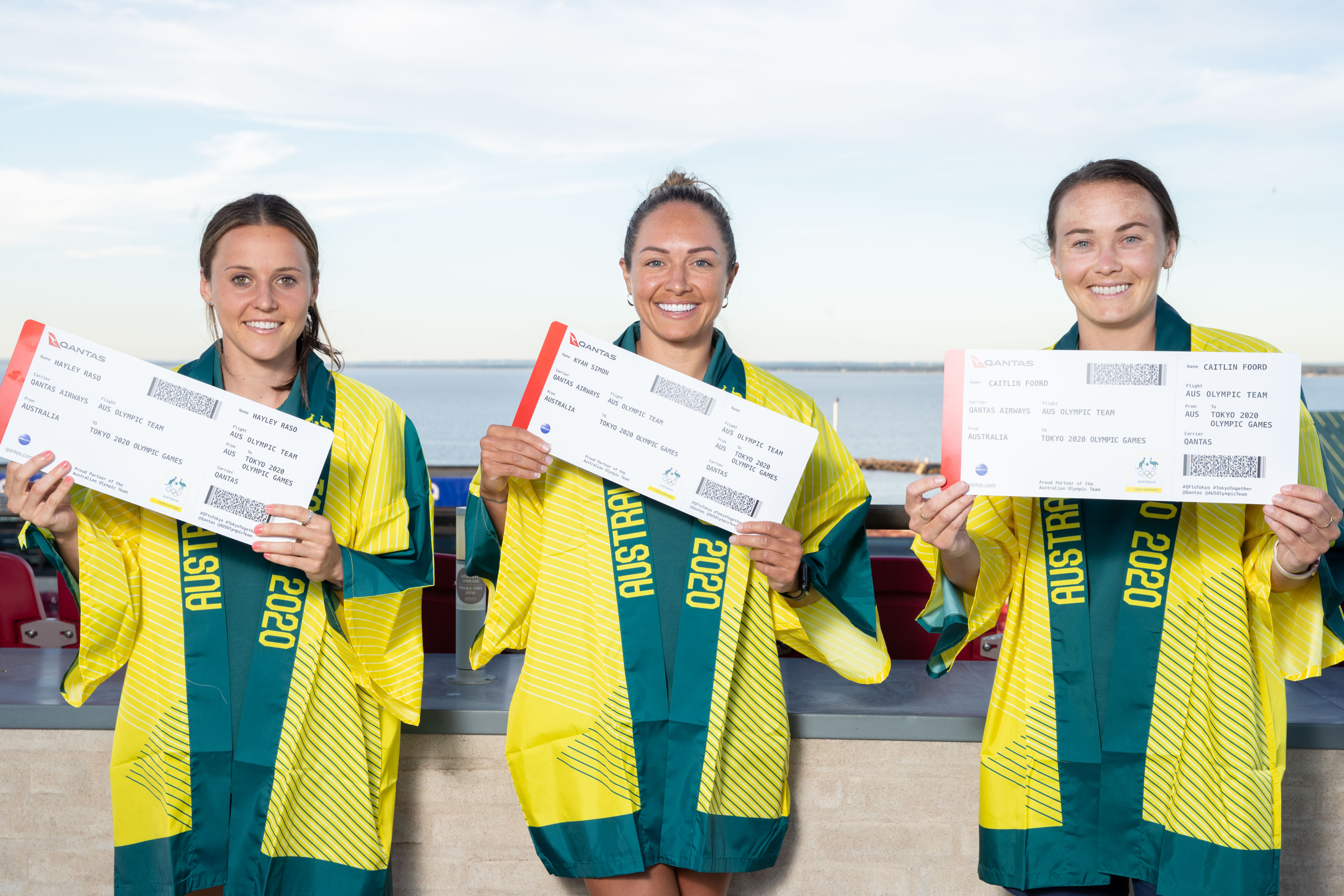 Hayley Raso, Kyah Simon and Caitlin Foord with their Tokyo 2020 Olympic Qantas boarding passes Hayley Raso, Kyah Simon and Caitlin Foord with their Tokyo 2020 Olympic Qantas boarding passes