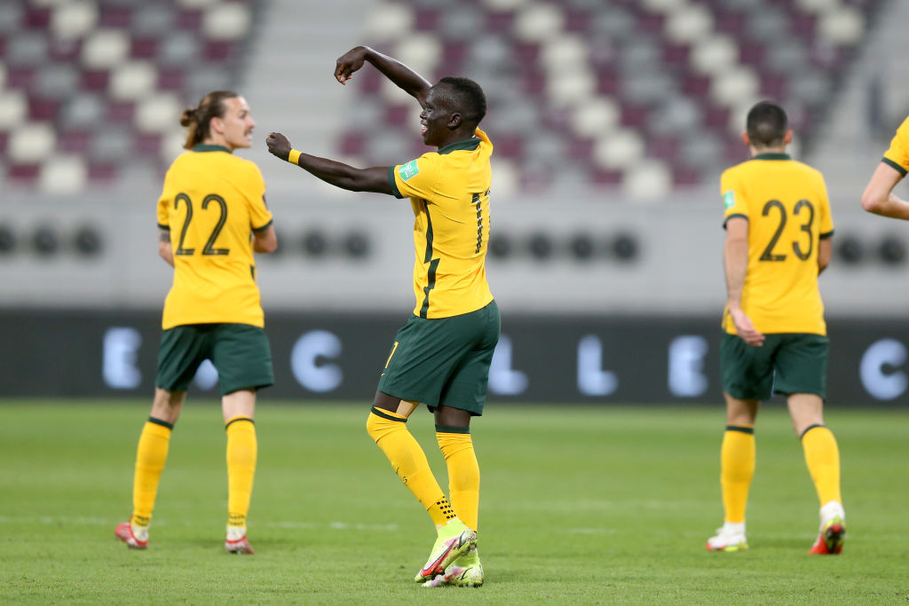 Awer Mabil of Australia celebrates after scoring the first goal during the 2022 FIFA World Cup Qualifier match between Australia and Oman at Khalifa International Stadium on October 7, 2021 in Doha, Qatar. (Photo by Mohamed Farag/Getty Images) Awer Mabil of Australia celebrates after scoring the first goal during the 2022 FIFA World Cup Qualifier match between Australia and Oman at Khalifa International Stadium on October 7, 2021 in Doha, Qatar. (Photo by Mohamed Farag/Getty Images)