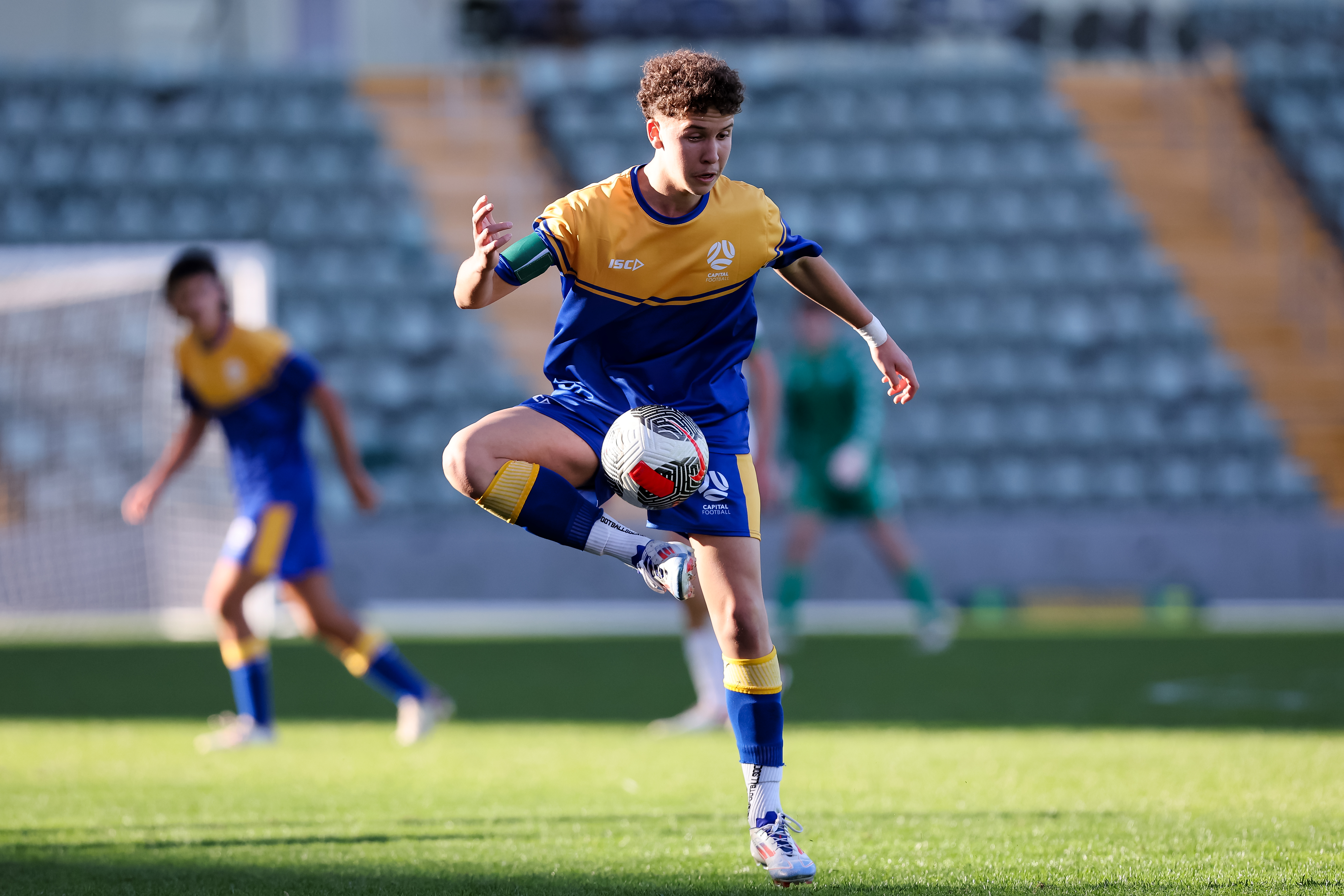 Capital Football captain juggles the ball