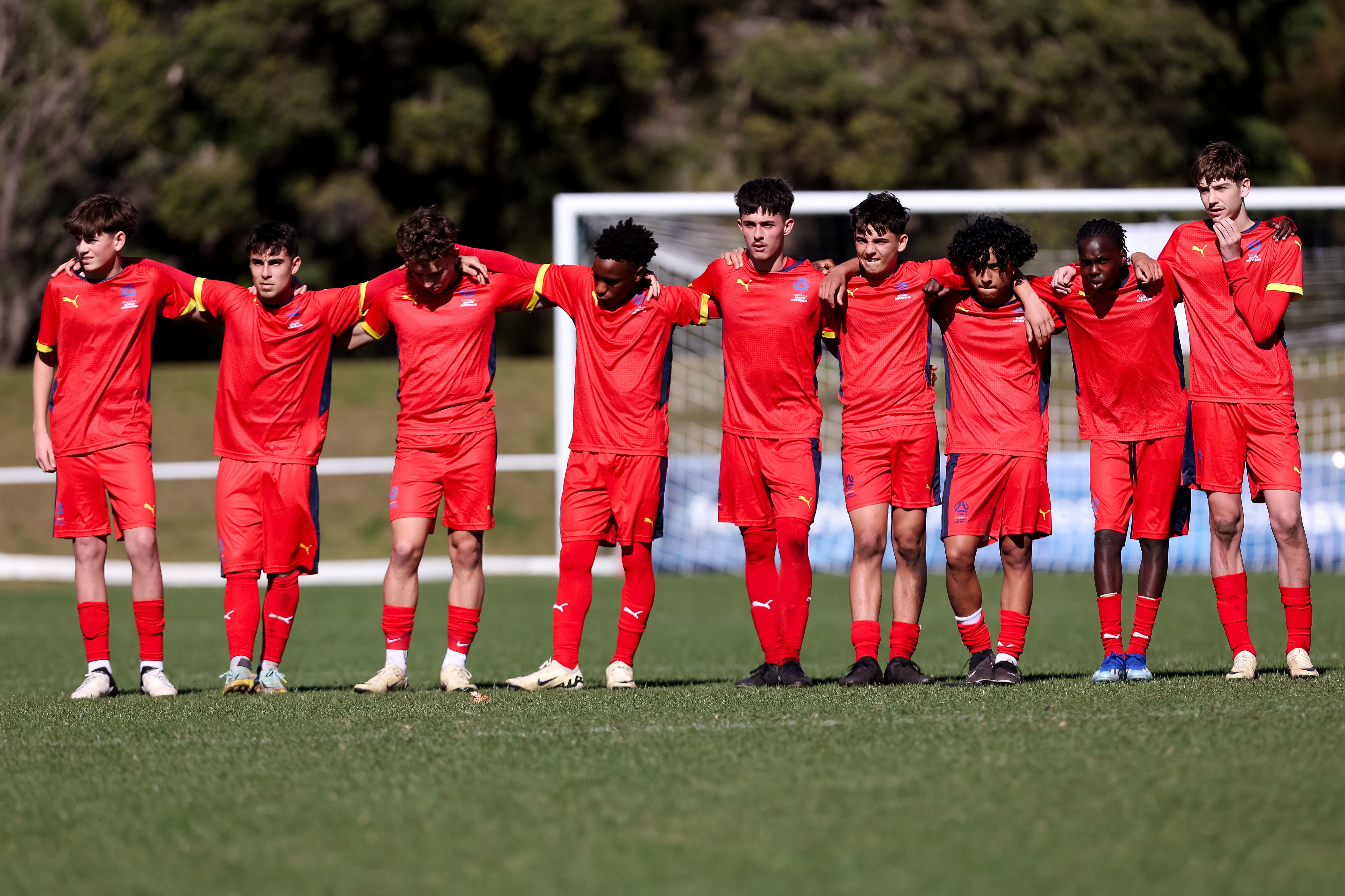 South Australia's Under 15 side nervously watch on during the penalty shootout. Photo Damian Briggs/Football Australia