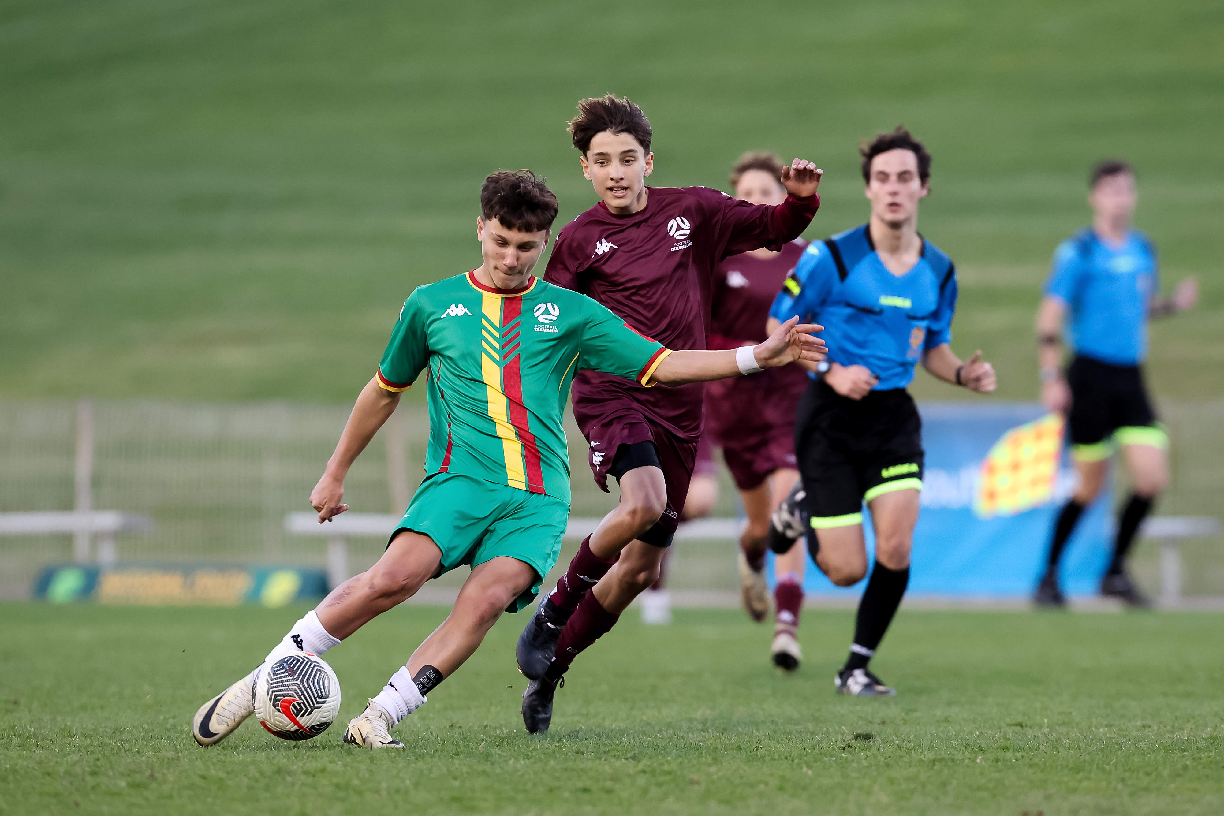 Tasmaina's Under 16 side on the charge against Queensland Silver