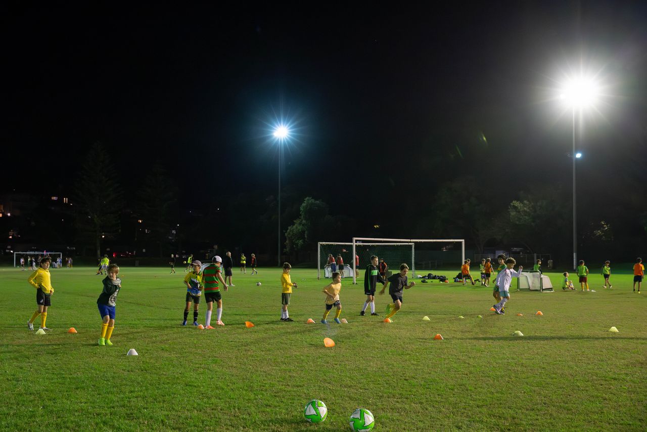 Maroubra United players training under lights (photo: Football Australia)