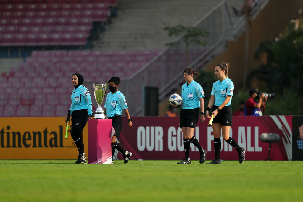 Referee Casey Reibelt (2nd R) and match officials walk into the pitch prior to the AFC Women's Asian Cup final between China and South Korea at DY Patil on February 6, 2022 in Navi Mumbai, India. (Photo by Thananuwat Srirasant/Getty Images)