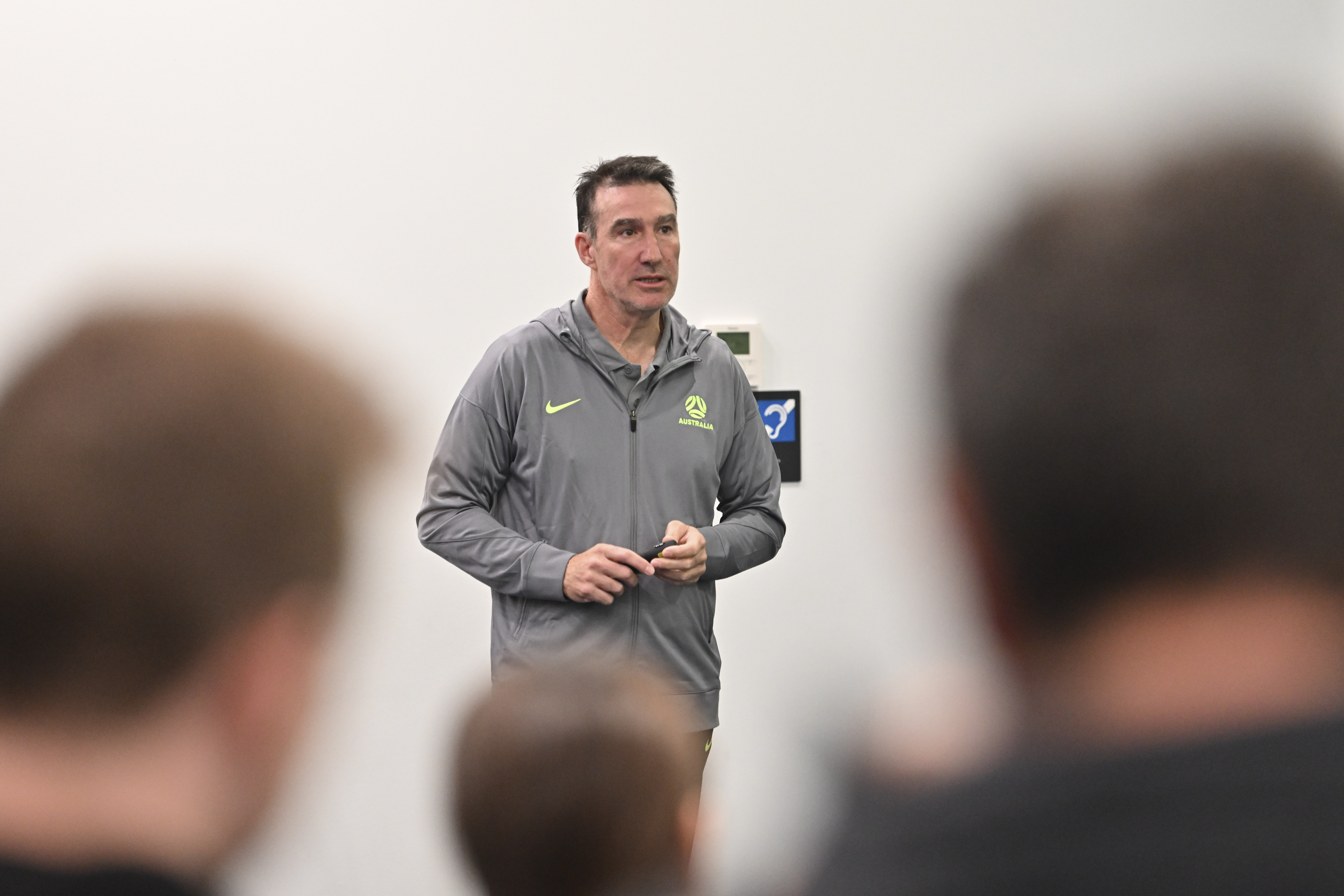 Tony Vidmar addresses the group