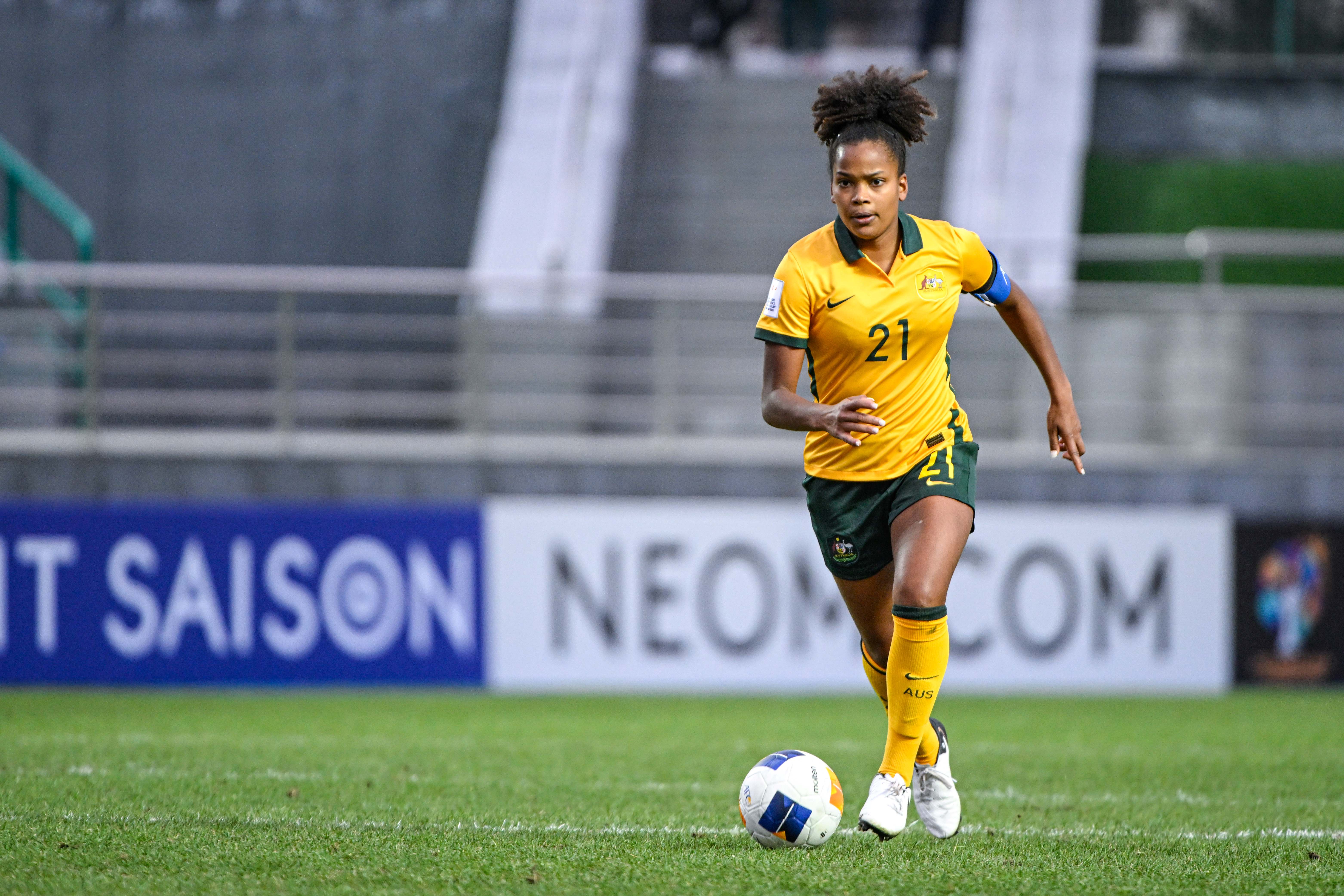 Naomi Chinnama, wearing the captain's armband, on the ball for the Young Matildas against Uzbekistan. Photo: HASAN PIRMUHAMEDOV, AFC